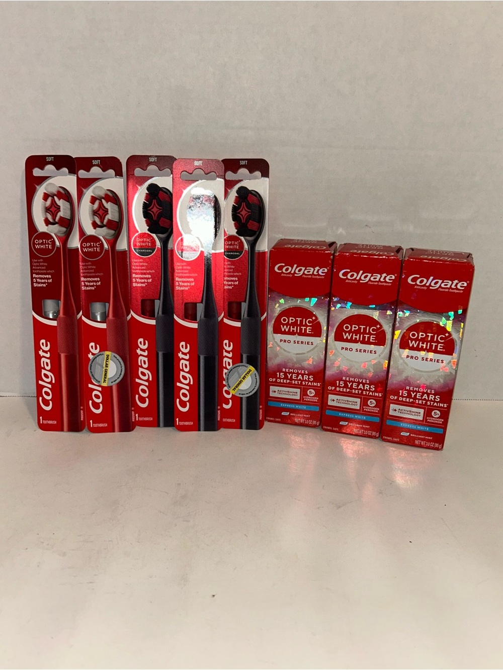 Colgate Optic White Toothbrush & Toothpaste Bundle of 8 New - Red & Black